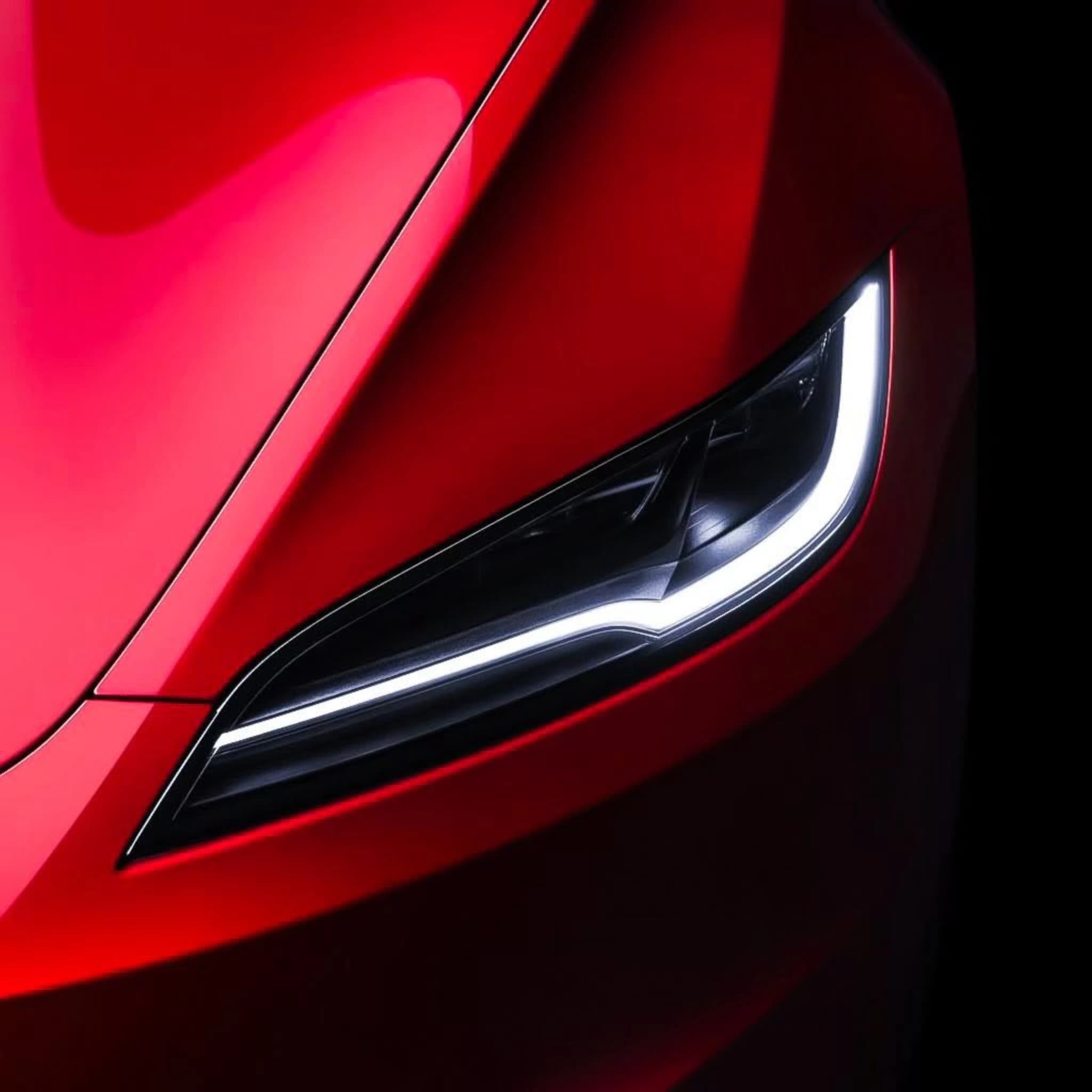 red tesla model 3 headlight detail