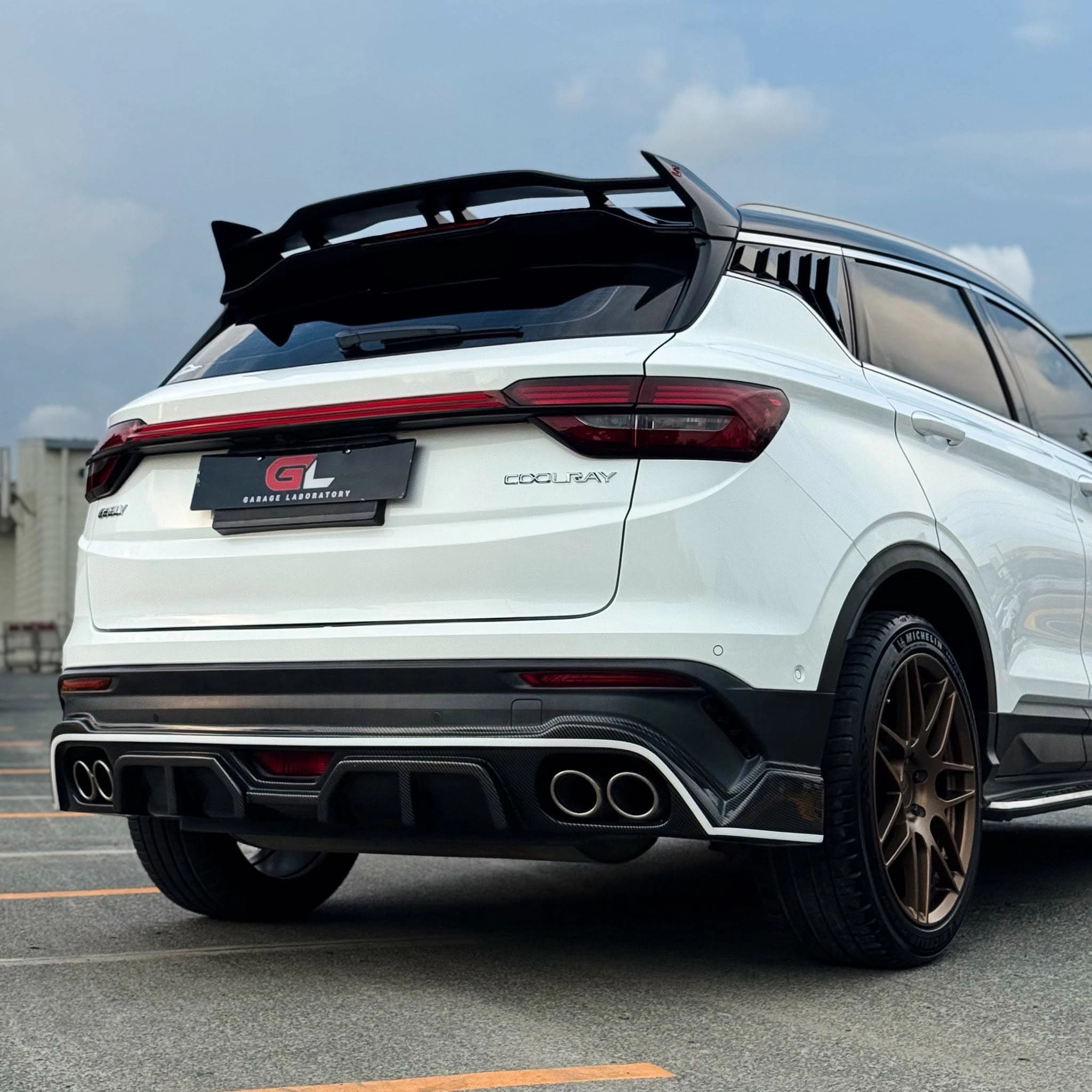 white geely suv rear angle