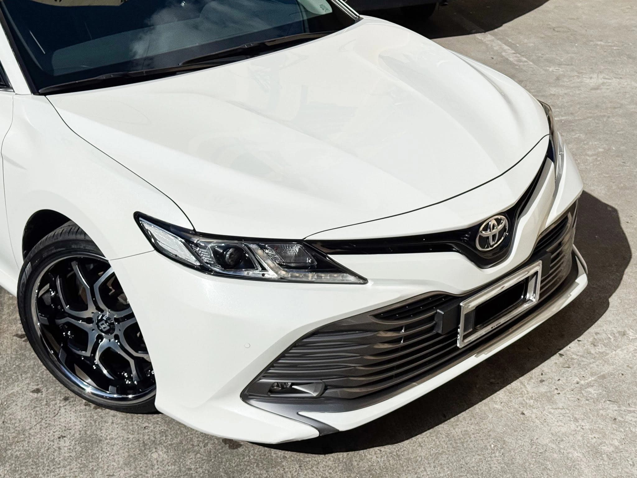 white toyota camry front three quarter