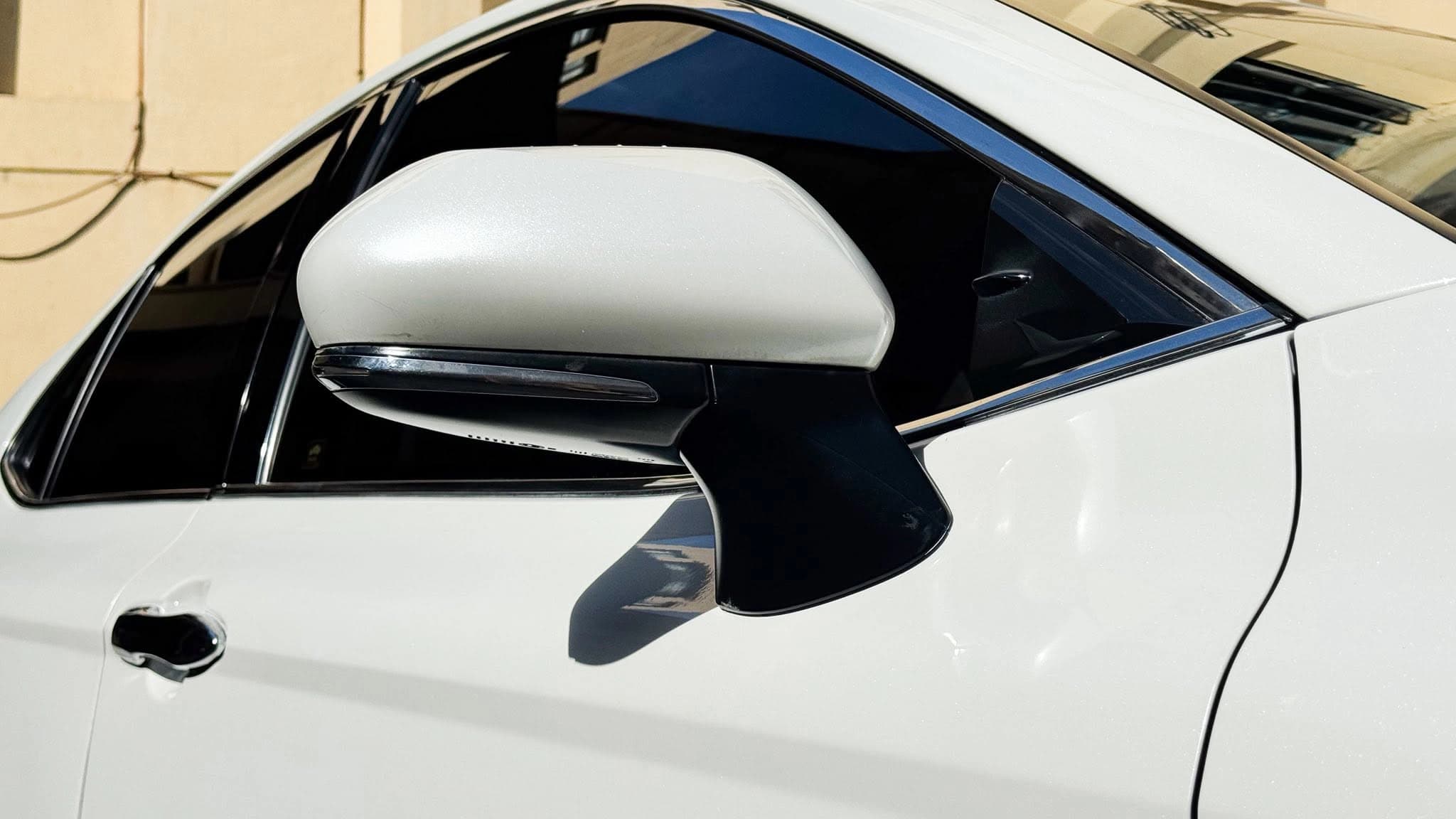 white toyota camry side mirror detail
